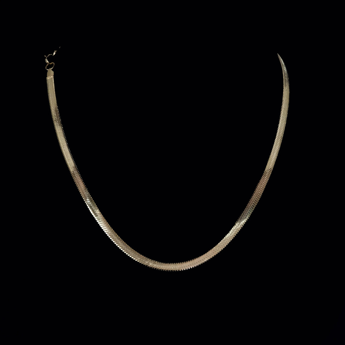 Silver herringbone chain necklace.