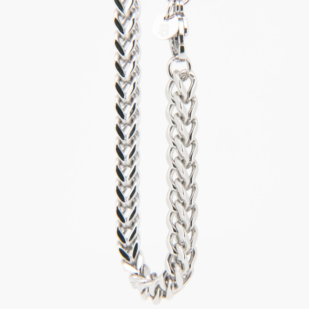 Silver chain necklace with a braided link pattern.