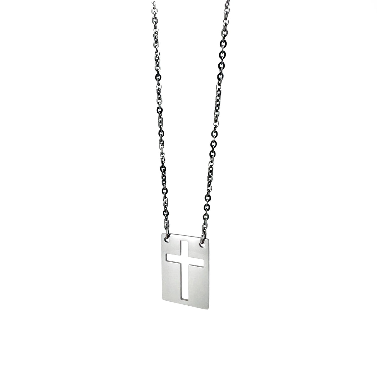 Silver pendant necklace featuring a rectangular charm with a cross cutout design.