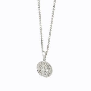 Silver pendant necklace featuring a circular medallion with a Chi Rho symbol.