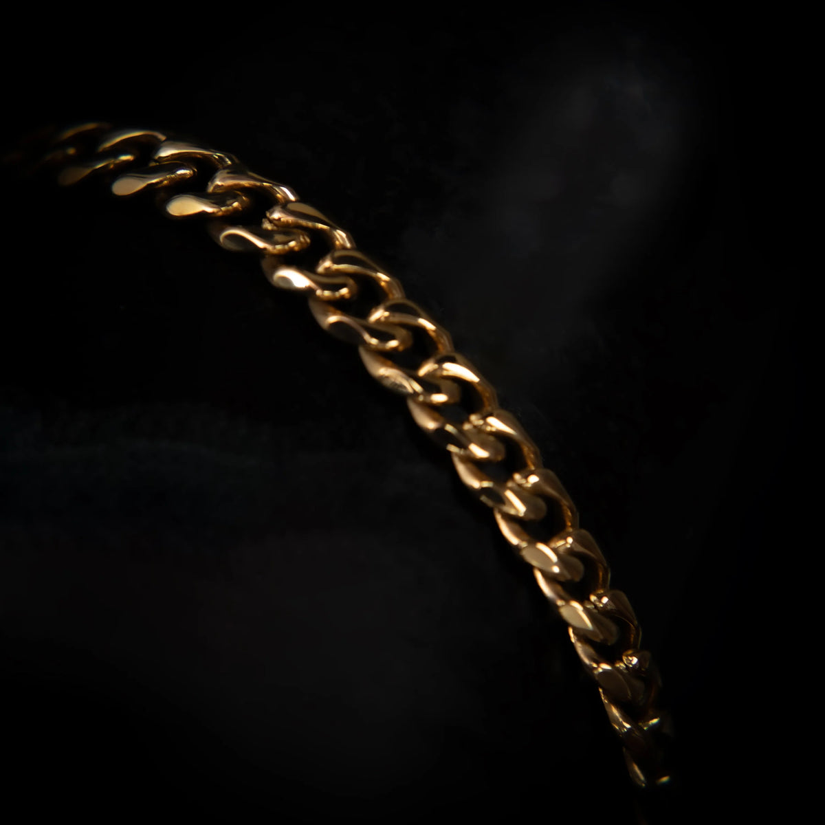 Gold chain bracelet with interlocking links.