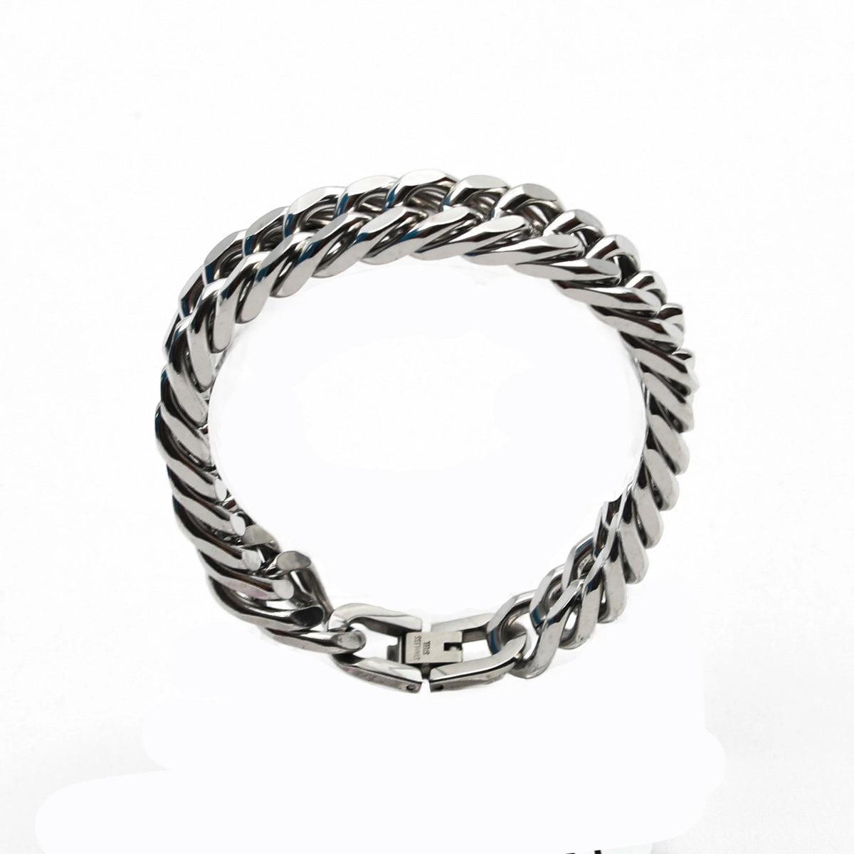 Silver chain bracelet with a twisted link design and clasp closure.