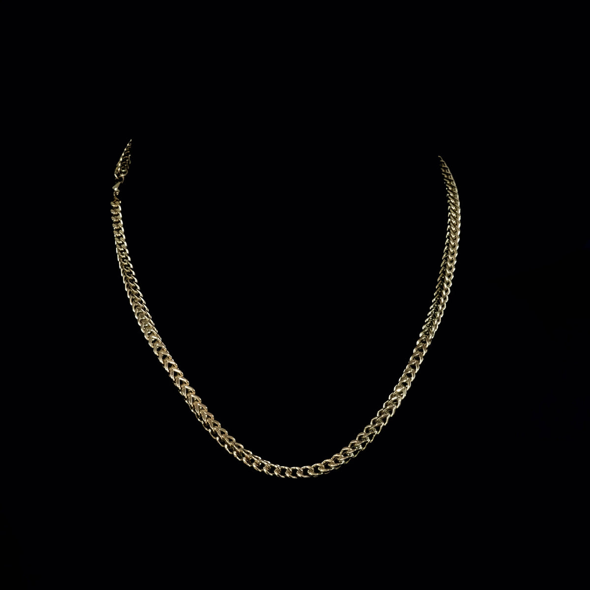 Gold chain necklace with interlocking links.