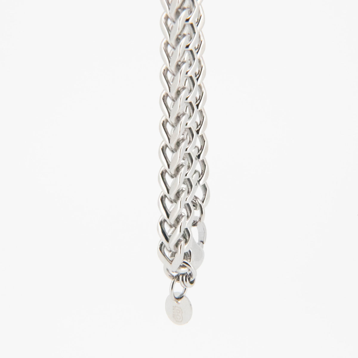 Silver chain bracelet with an intricate braided pattern.