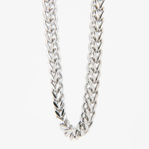 Silver chain necklace with a braided link pattern.