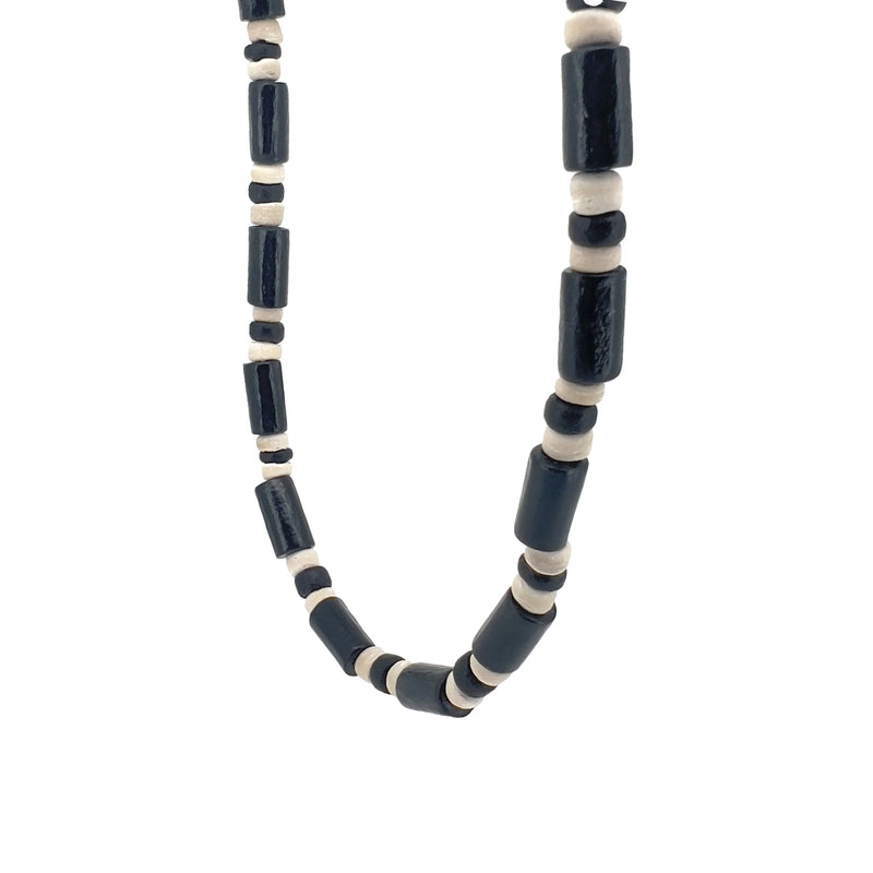 Necklace made of alternating black and white beads.