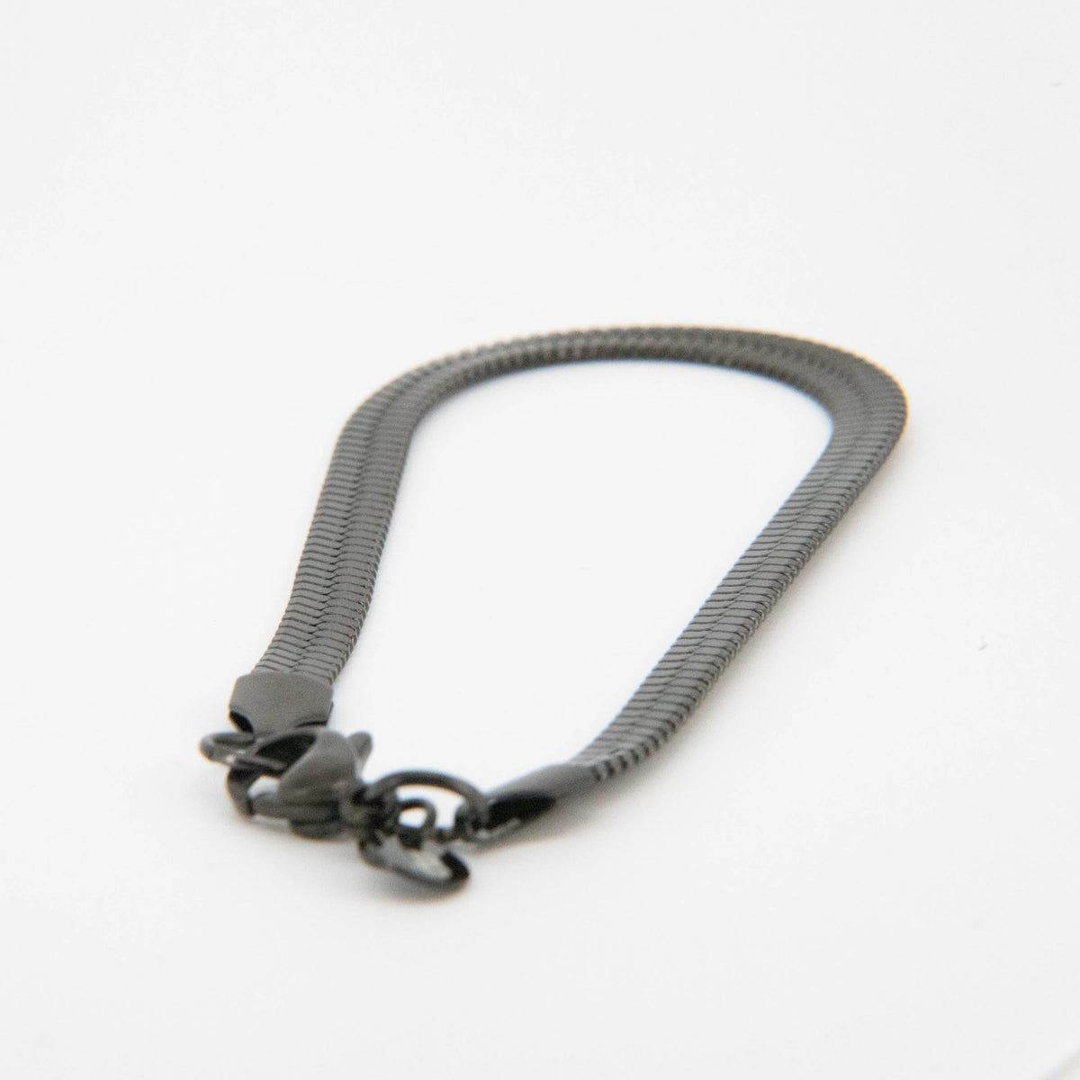 Gray metal chain bracelet with clasps at both ends.