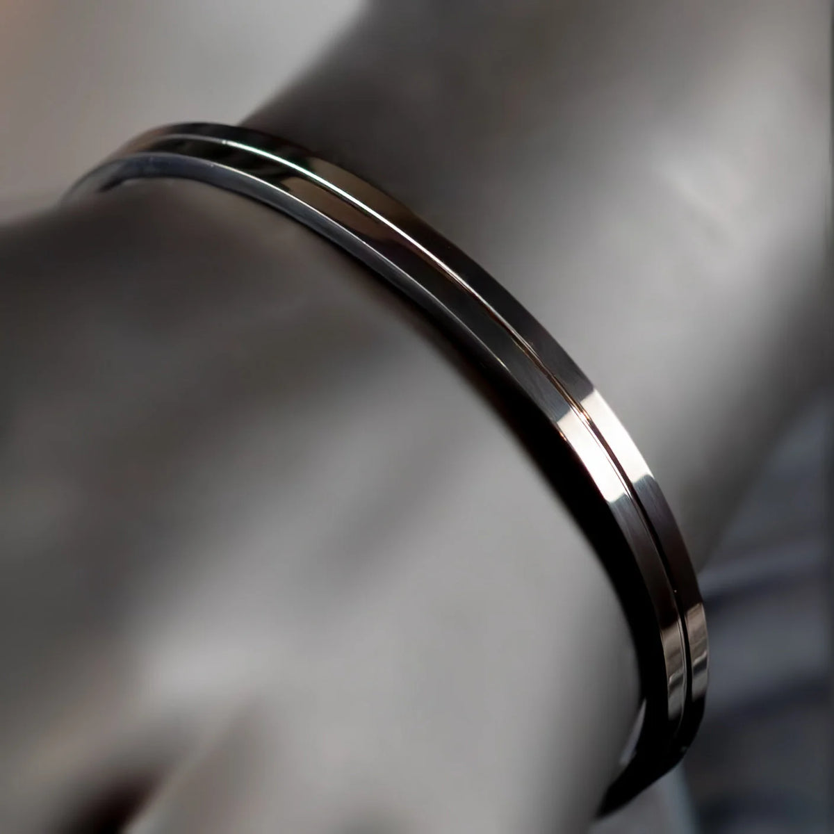 Sleek metallic bracelet or bangle with a polished finish.