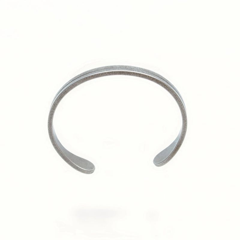 Silver open-ended cuff bracelet with a simple, minimalist design.