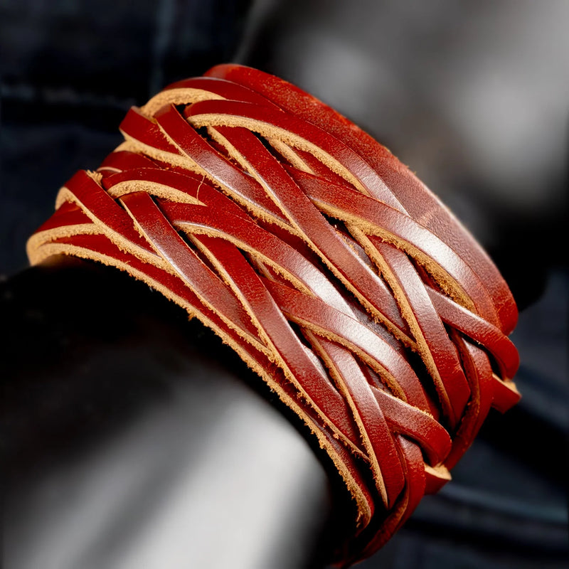 Intricately woven red leather bracelet with overlapping strands.