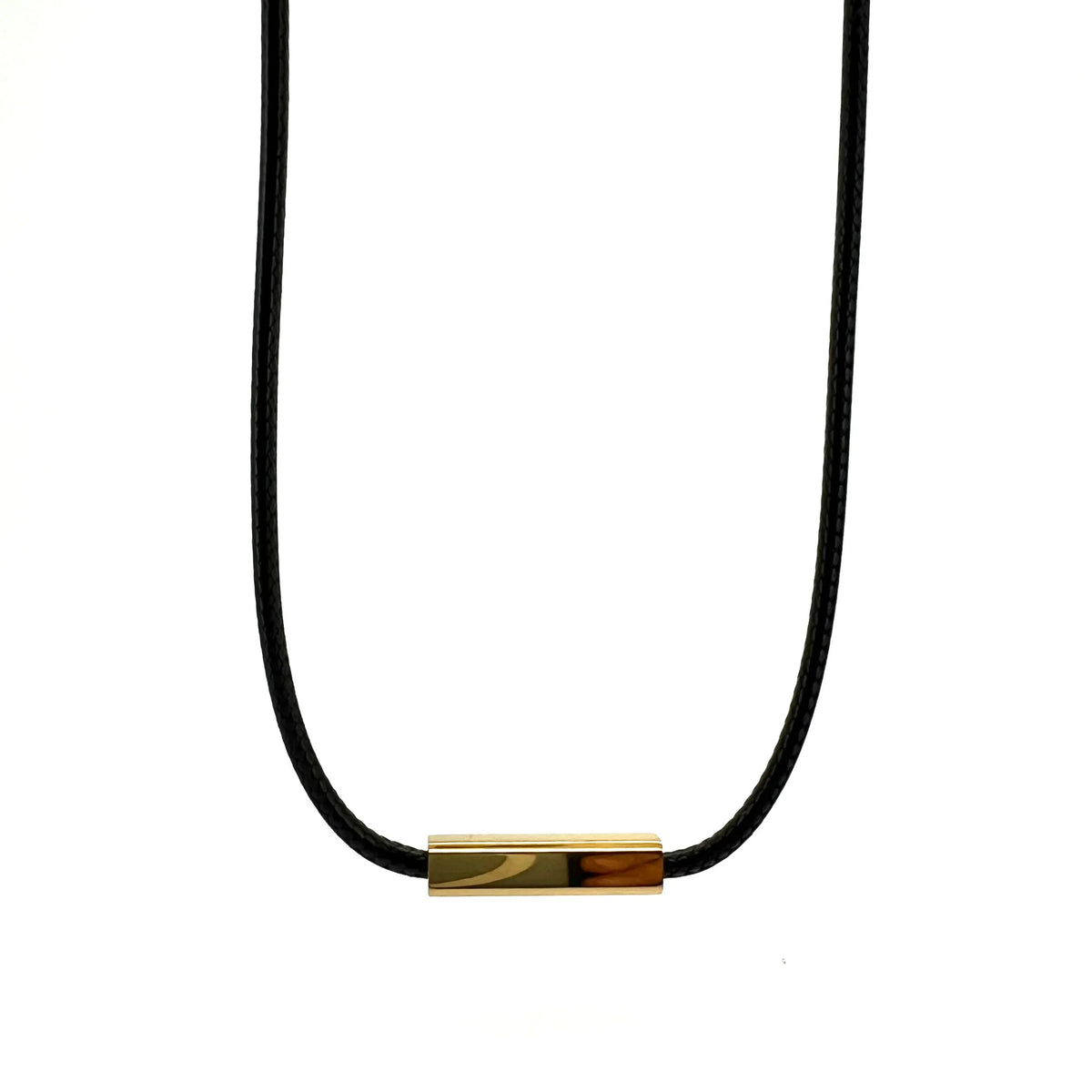 Minimalist necklace with a black cord and small gold-colored rectangular pendant.