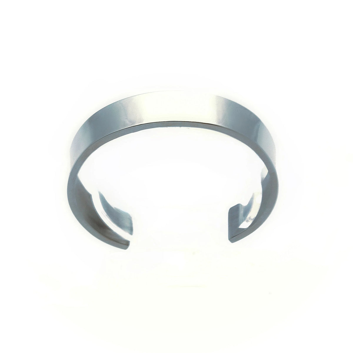 Silver metal cuff bracelet with open ends.