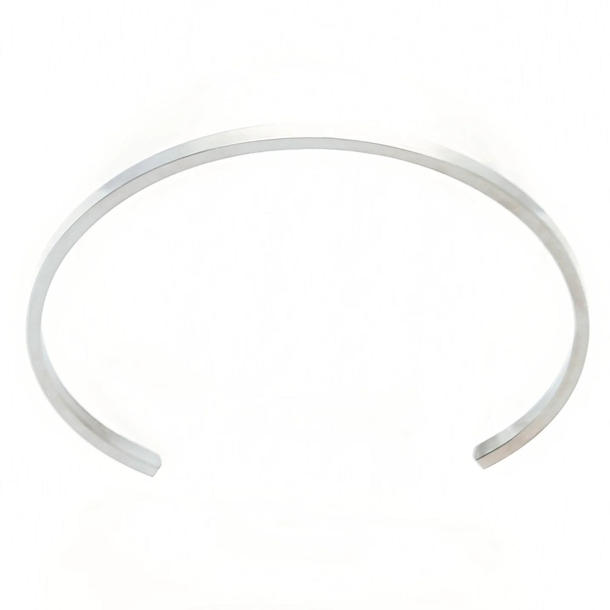 Simple, thin silver cuff bracelet with an open design.