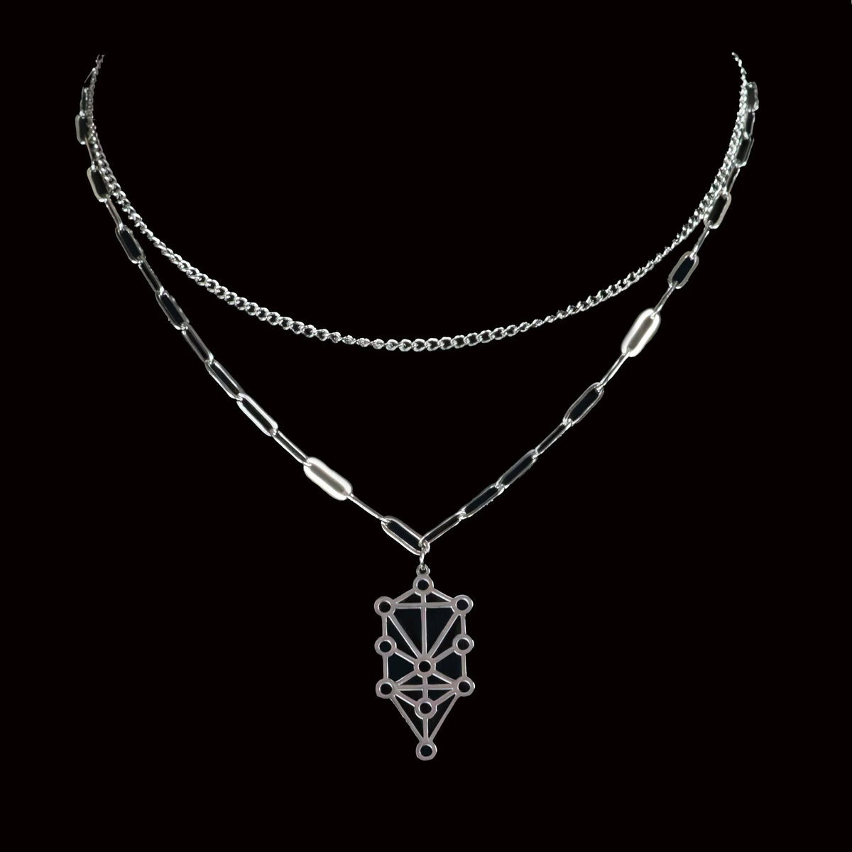 Layered silver necklace with a geometric pendant resembling the Kabbalah Tree of Life symbol.