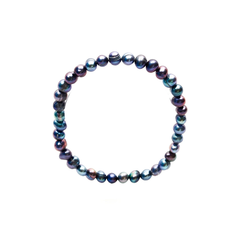 Pearl bracelet with iridescent blue and purple beads.