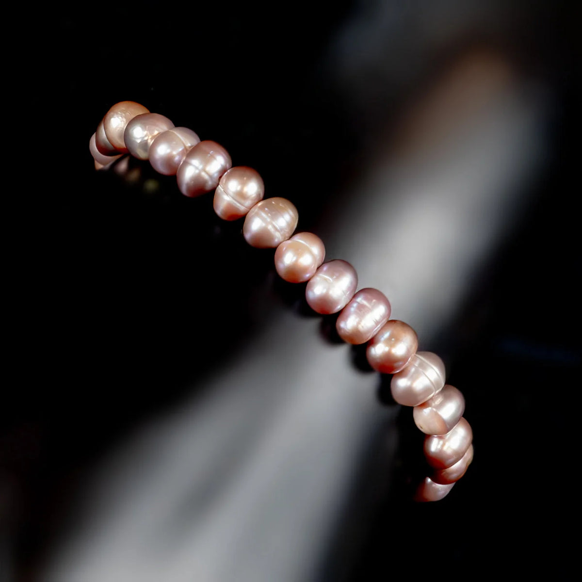 String of pale pink pearls with a lustrous sheen.